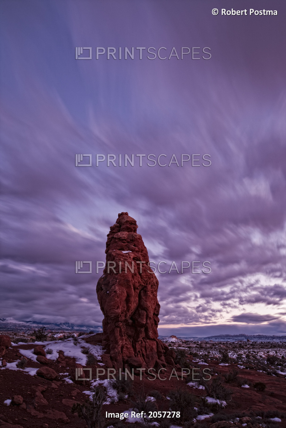 Timed Exposure Of Sunset Clouds Over Pinnacle In Arches National Park, Utah.