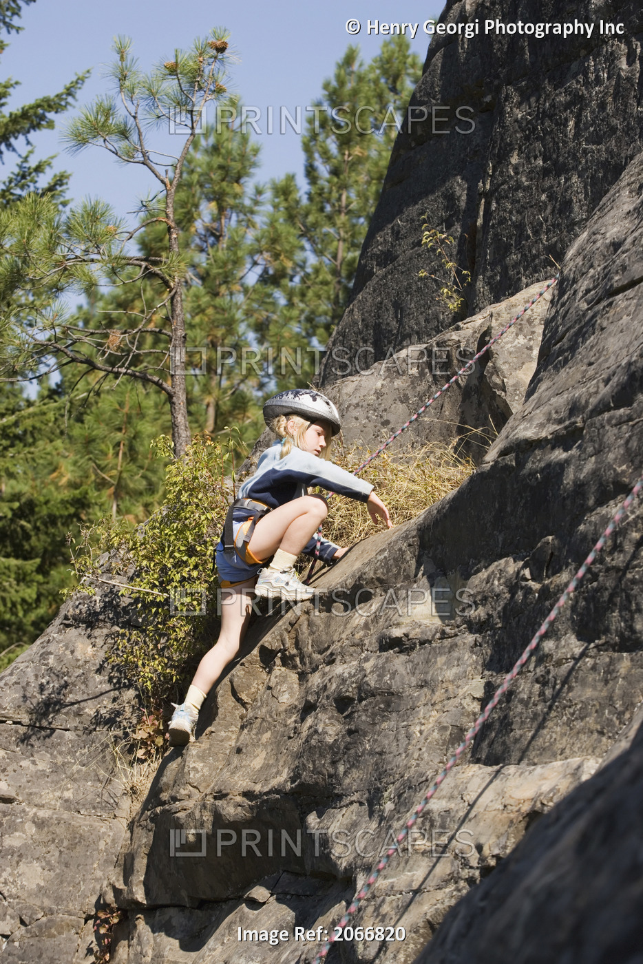 Young Girl (Age 7) Climbing On Granite Cliff At Stone Hills Near Rexford, ...