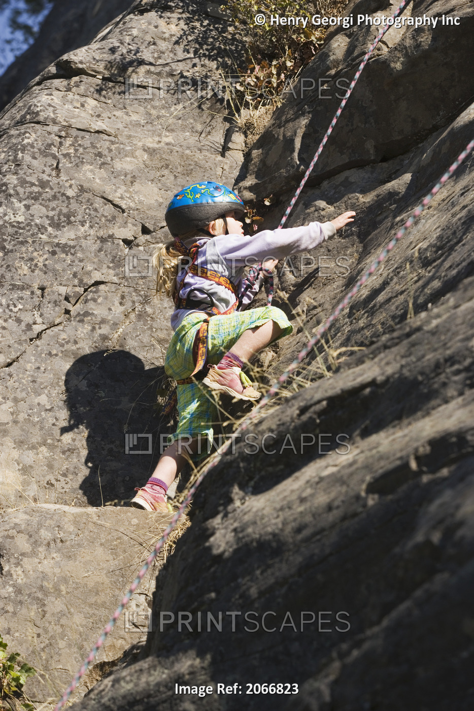 Young Girl (Age 5) Climbing On Granite Cliff At Stone Hills Near Rexford, ...