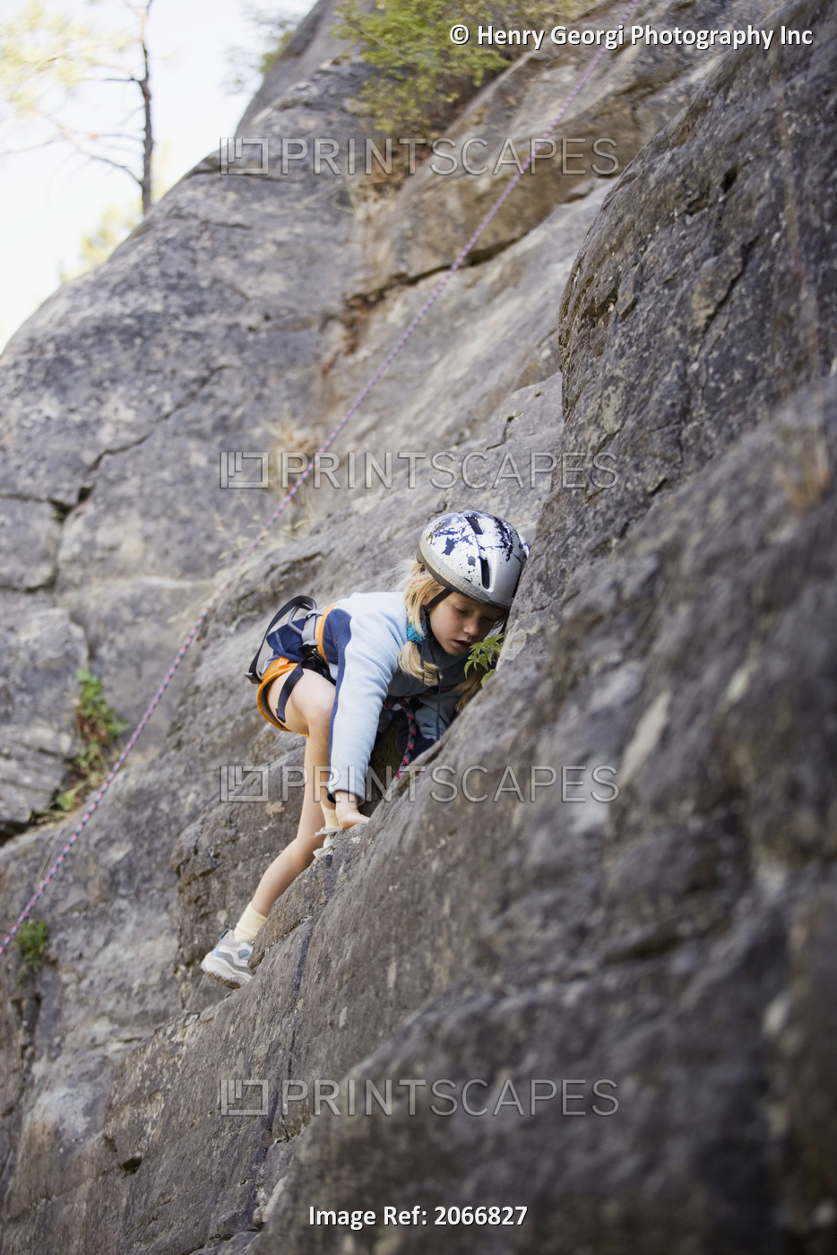 Young Girl (Age 7) Climbing On Granite Cliff At Stone Hills Near Rexford, ...