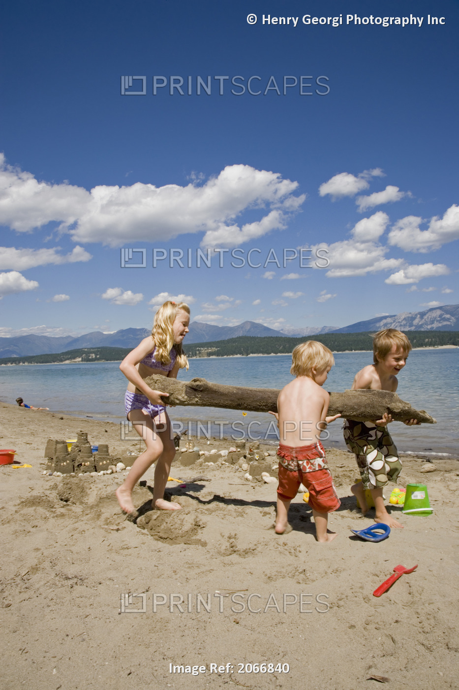 Children Playing On Beach On Lake Koocanusa In The East Kootenays Near Fernie, ...