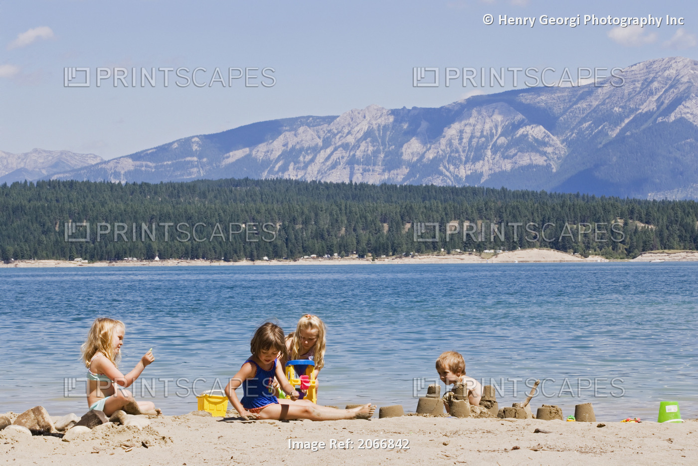 Children Playing On Beach On Lake Koocanusa In The East Kootenays Near Fernie, ...