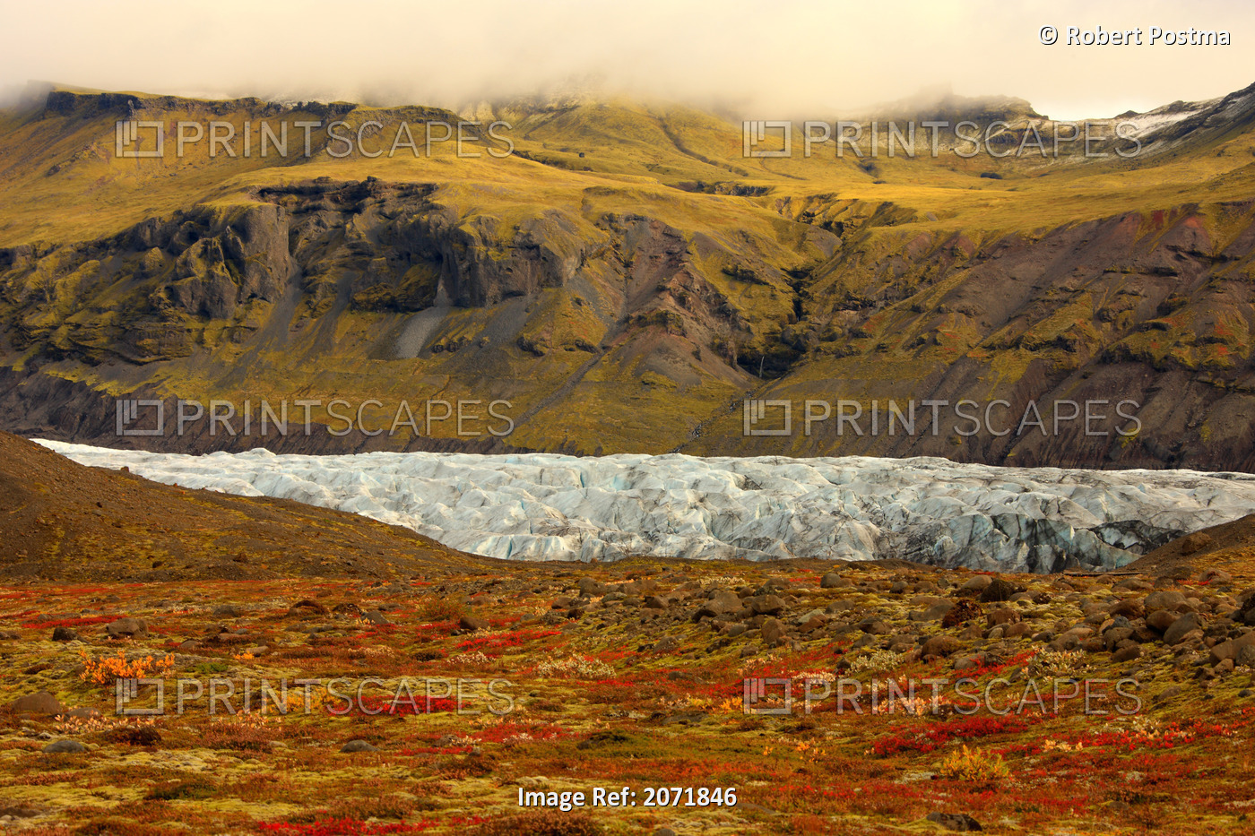 Tundra In Fall Colours With A Glacier Running Through One Of The Valleys In ...