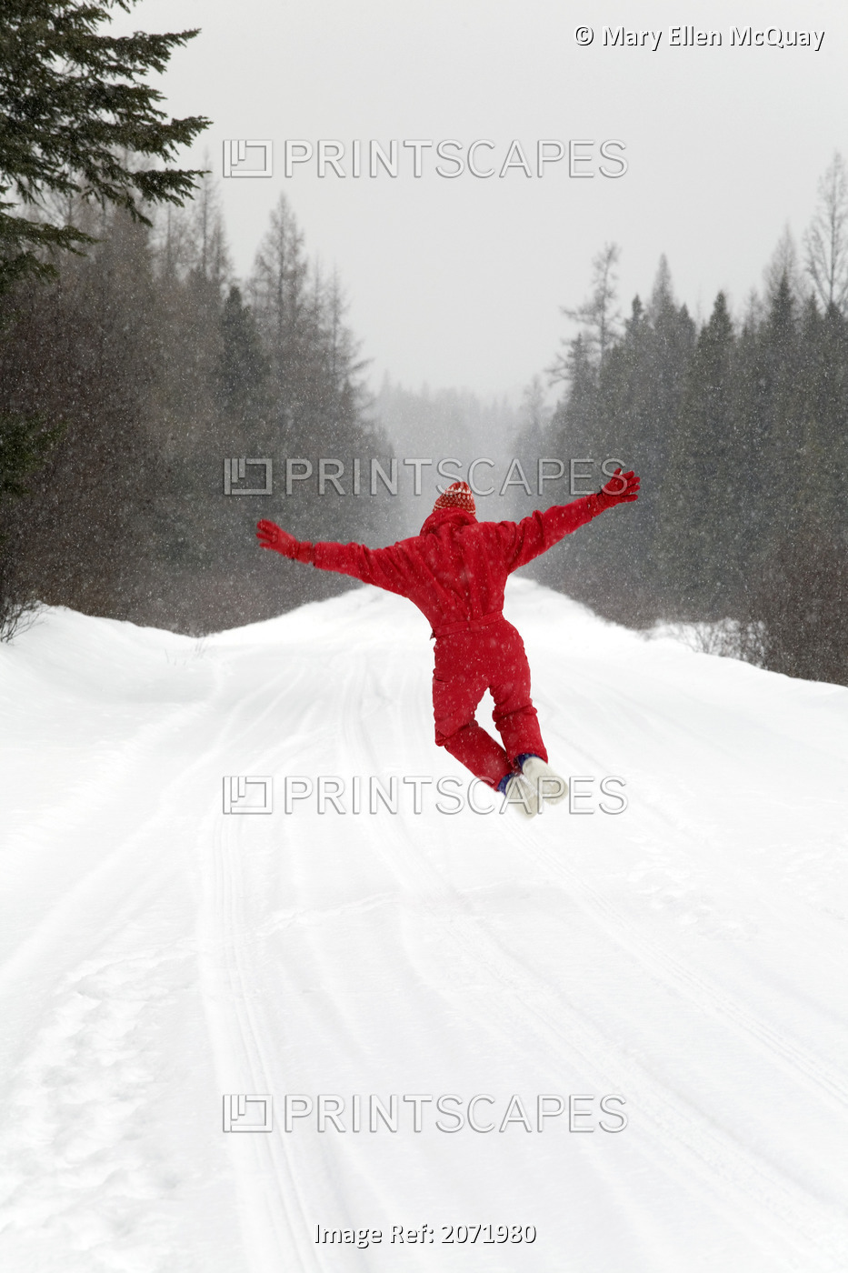 Senior Woman Leaping For Joy In The Snow, Algonquin Park, Ontario