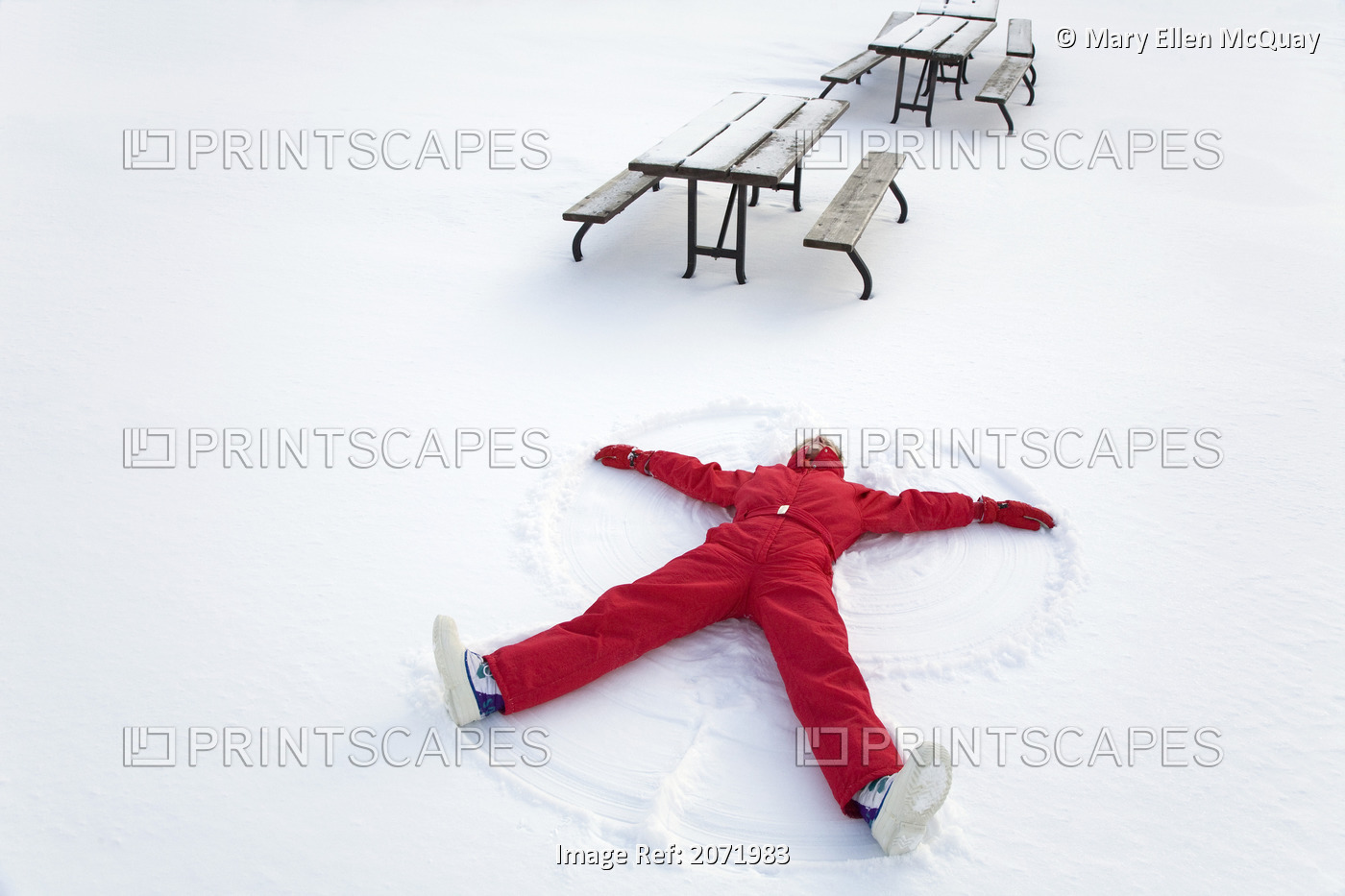 Senior Woman Making A Snow Angel, Algonquin Park, Ontario