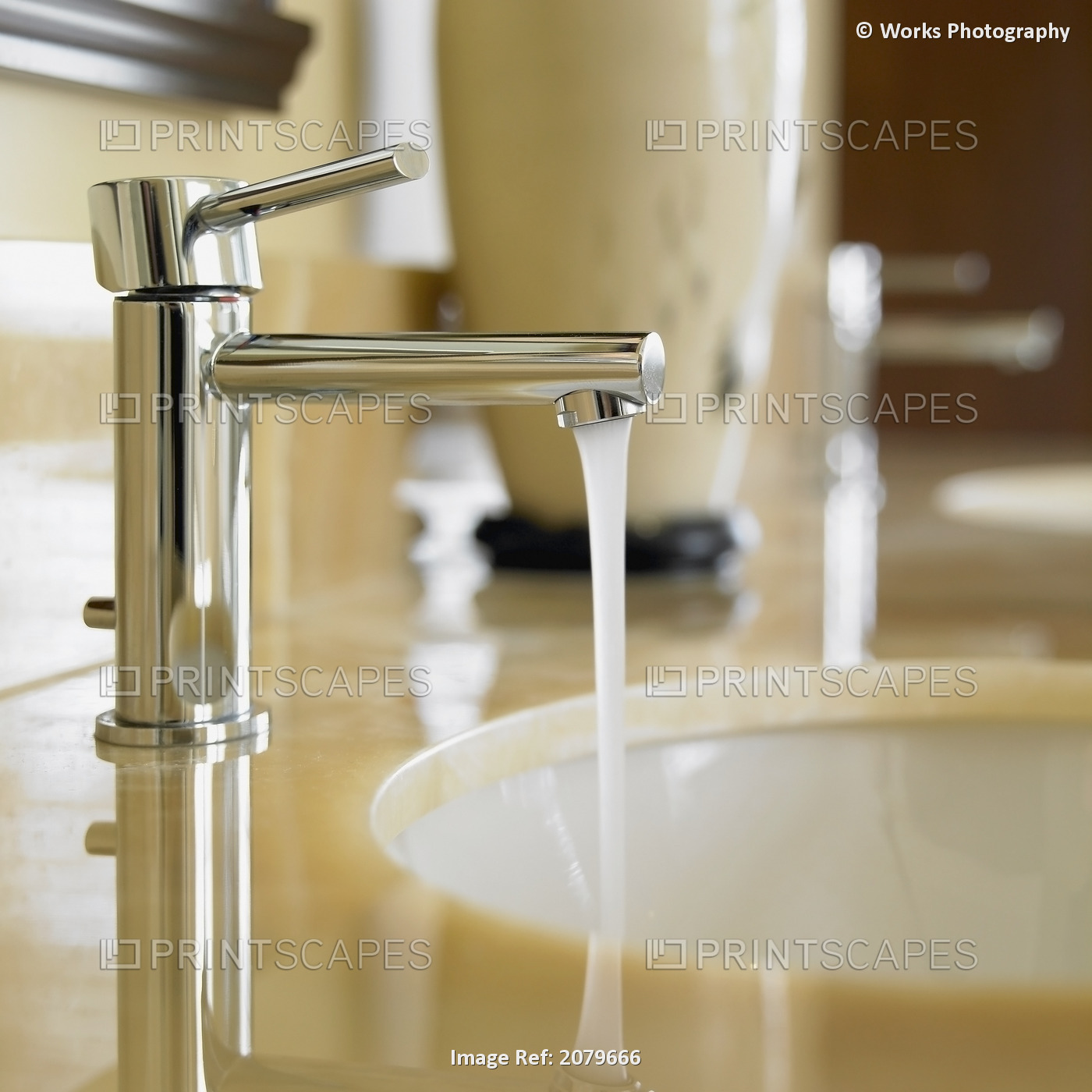 Close-Up Of Bathroom Faucet With Running Water And Marble Countertop, Victoria, ...