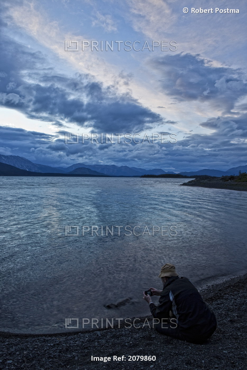 Person Taking A Picture While Sitting On The Shores Of Atlin Lake, Atlin ...