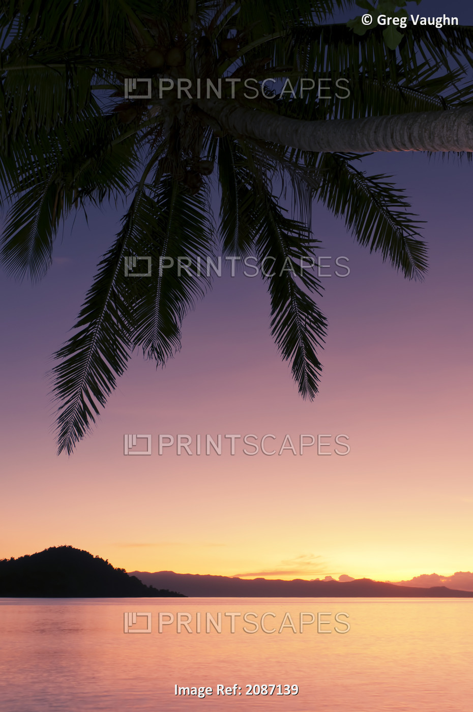Fiji, Matangi Private Island Resort, Sunset glow over ocean.