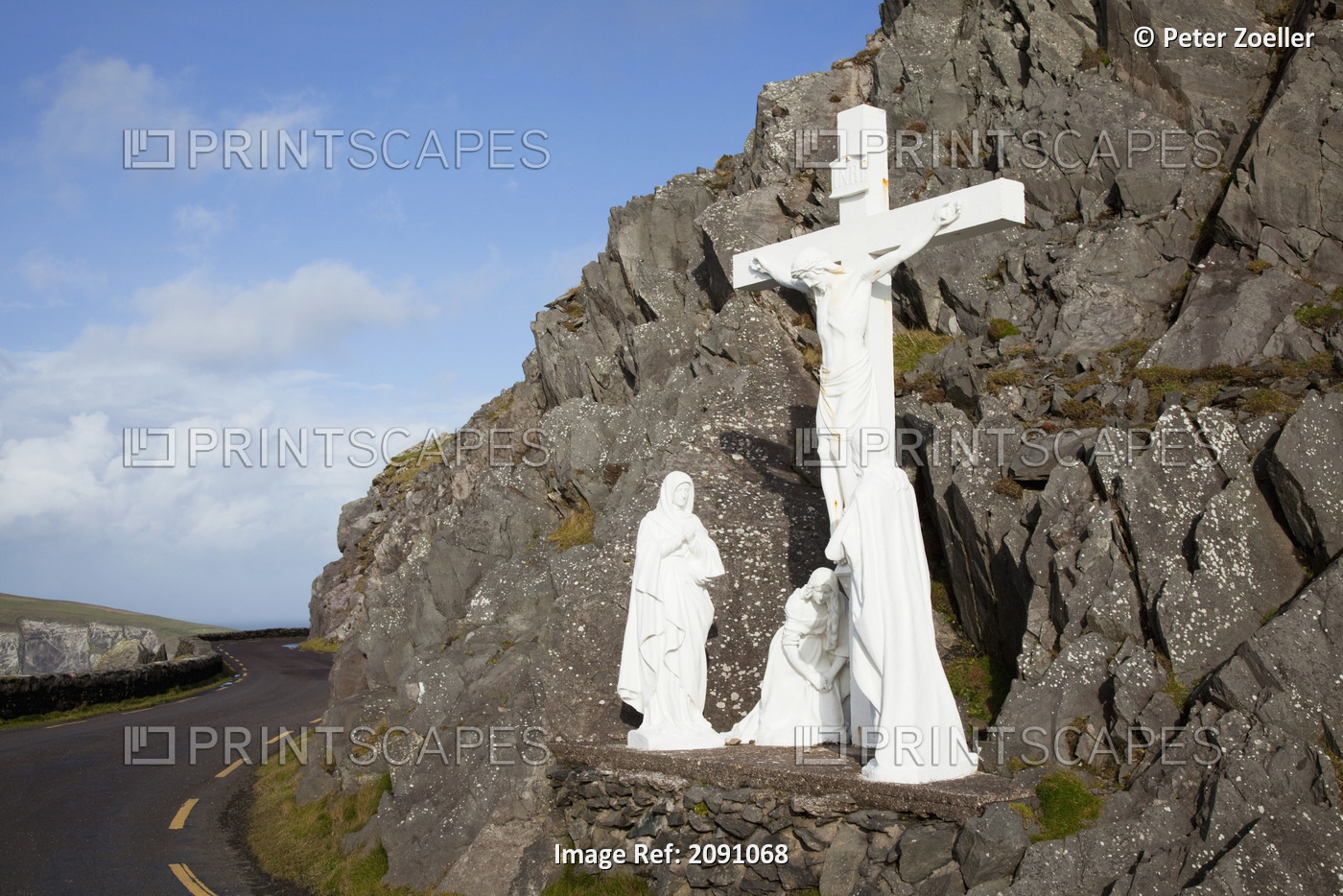 White religious figures standing on a rock beside the road at slea head near ...