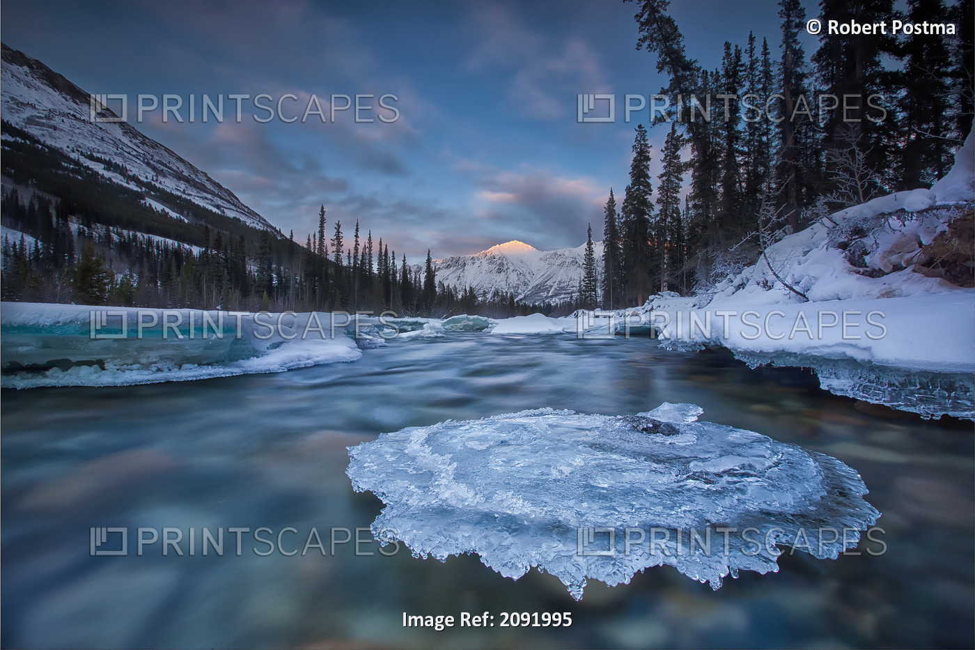 Sunset Over Ice-Covered Rock In Wheaton River; Yukon Canada