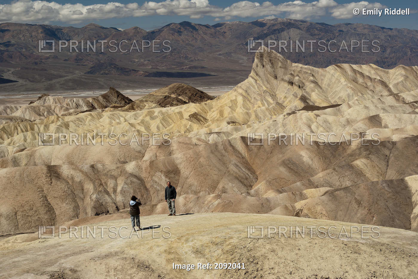 Hiker Taking A Photo In The Badlands Of Zabriskie Point In Death Valley ...