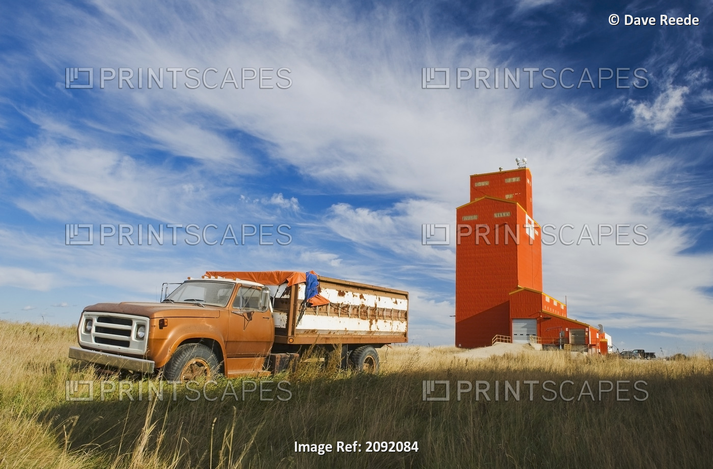 Old Farm Truck And Grain Elevator; Stoughton Saskatchewan Canada