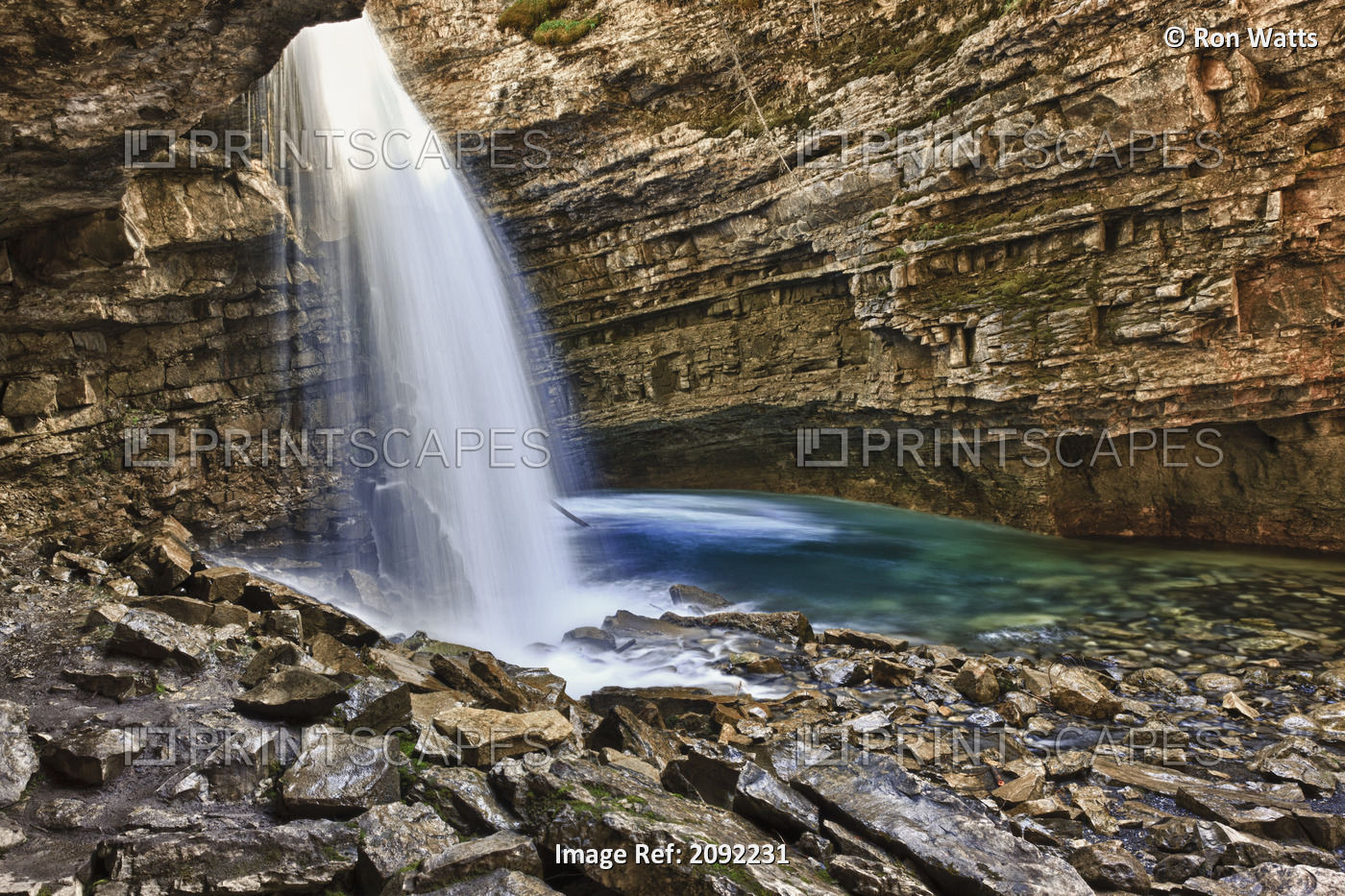 A River Cascades Over A Small Waterfall In Johnston Canyon In Banff National ...