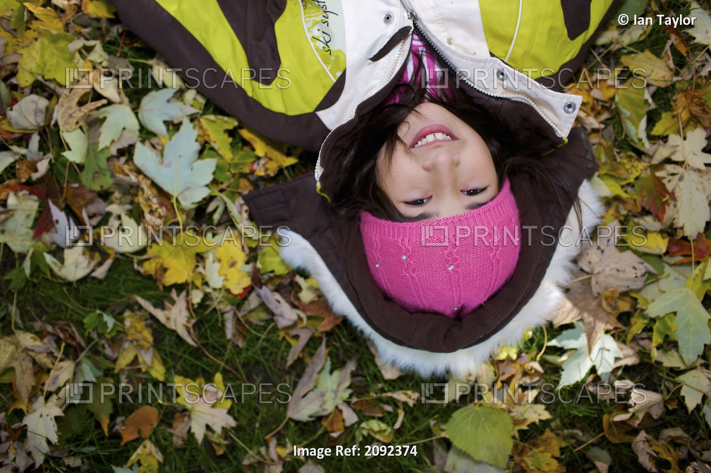 Middle Eastern Girl Lying In Autumn Leaves Outside Esl School; Guelph Ontario ...