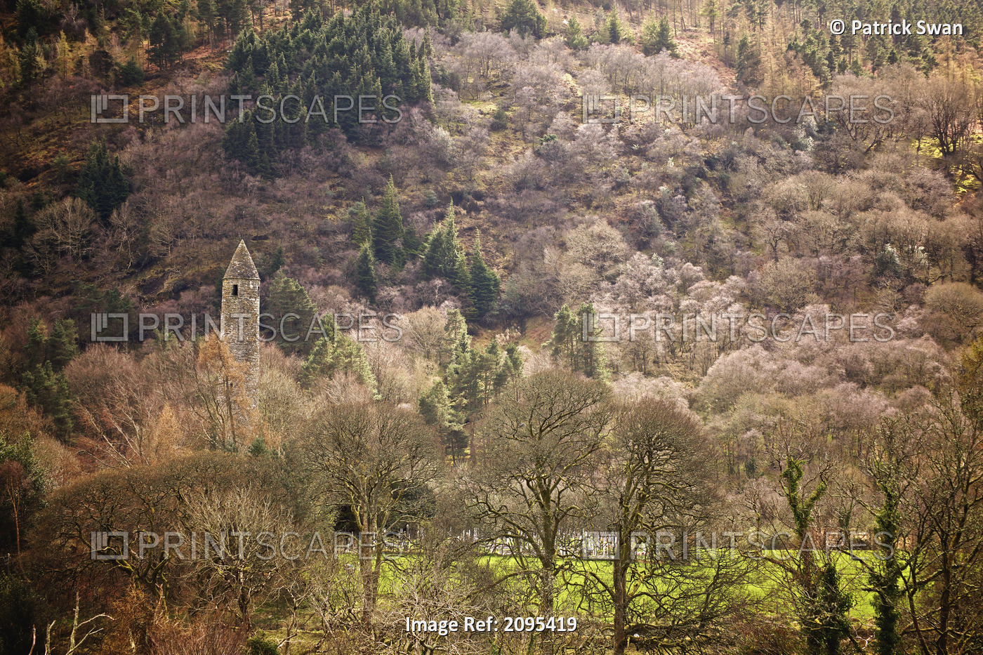 Round Tower Surrounded By Trees; Glendalough County Wicklow Ireland