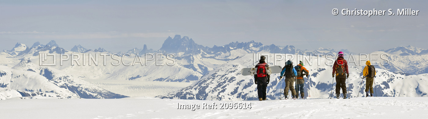 A Snowboarder And Skiers Hike Along The West Ridge Of Mt. Hawthorne Overlooking ...