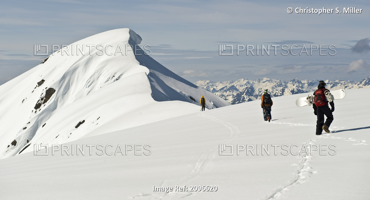 A Corniced Mt. Hawthorne Rises In The Background As Skiers And A Snowboarder ...