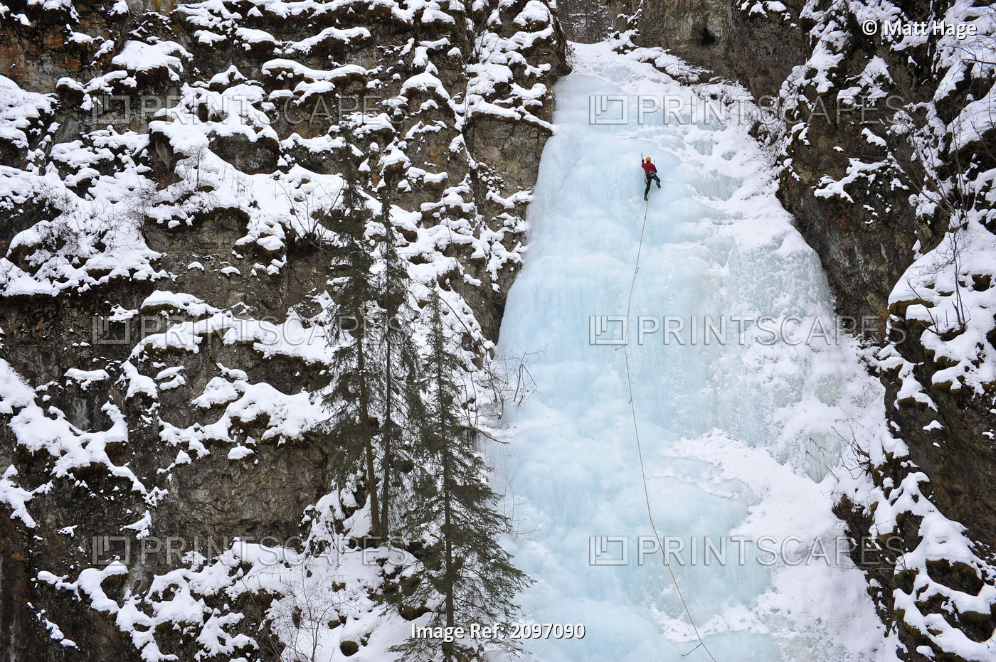 Woman Ice Climber Ascends A Large Icefall In Southcentral Alaska