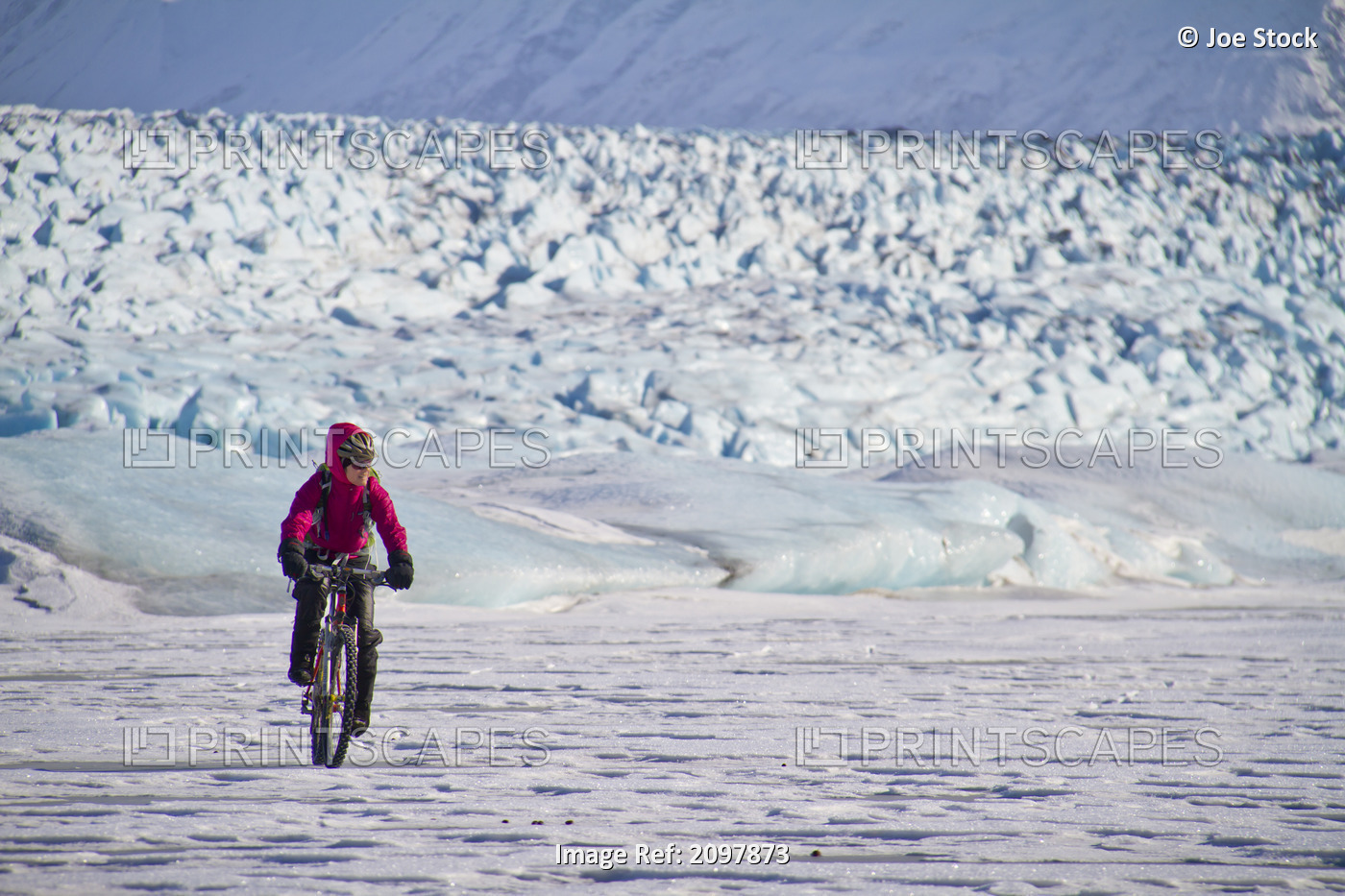 Woman Fat Tire Mountain Biking On The Knik Glacier, Chugach Mountains, ...