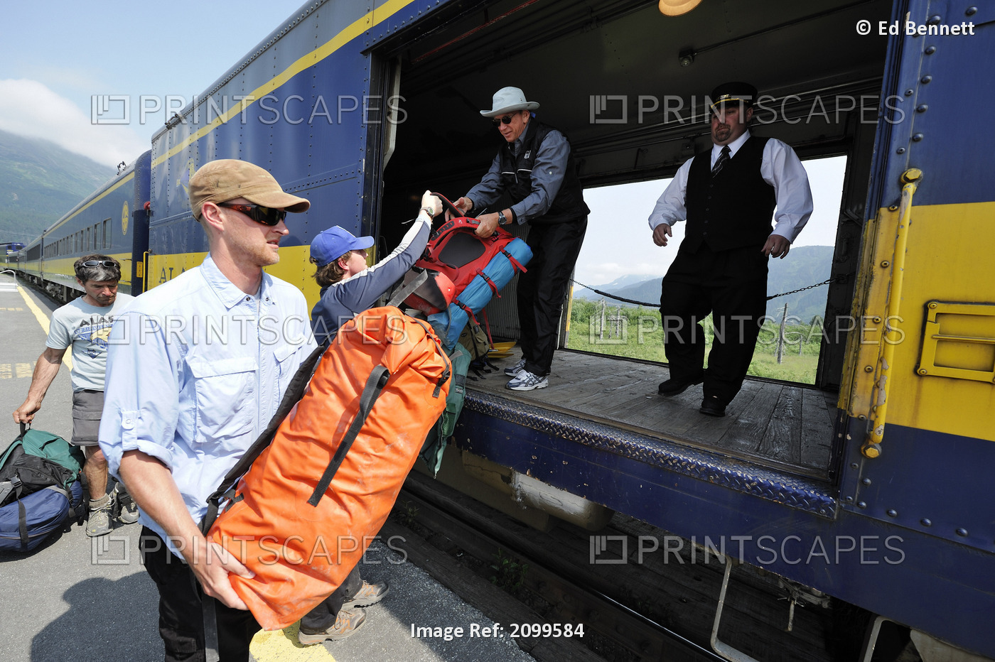 Male Tourist Hands A Dry Bag To The Brakeman On Alaska Railroad's Glacier ...