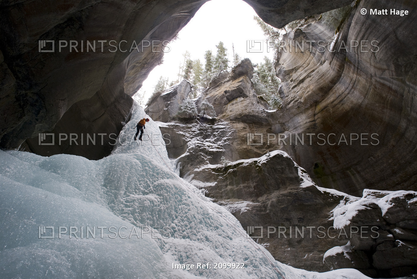 Female Ice Climber Rappels Into The Head Of Maligne Canyon In Jasper National ...