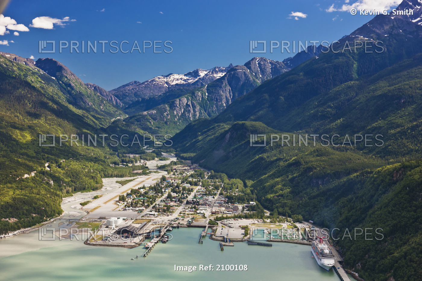 Aerial View Of The City Of Skagway With A Cruise Ship Docked At Port, Southeast ...