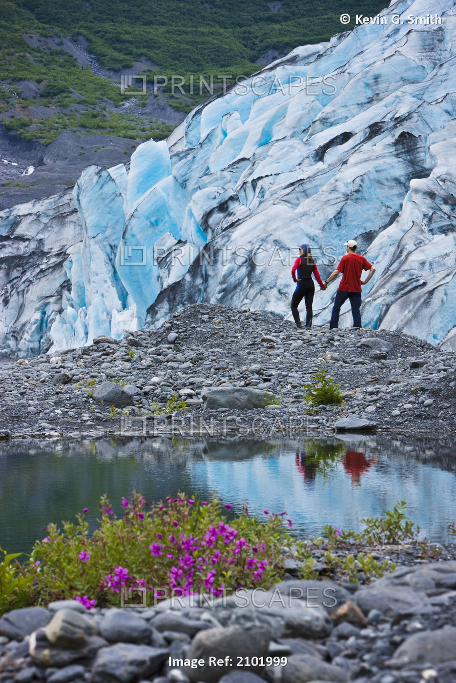 Hiking Couple Explore The Newly Exposed Ground Next To Shoup Glacier, Shoup Bay ...