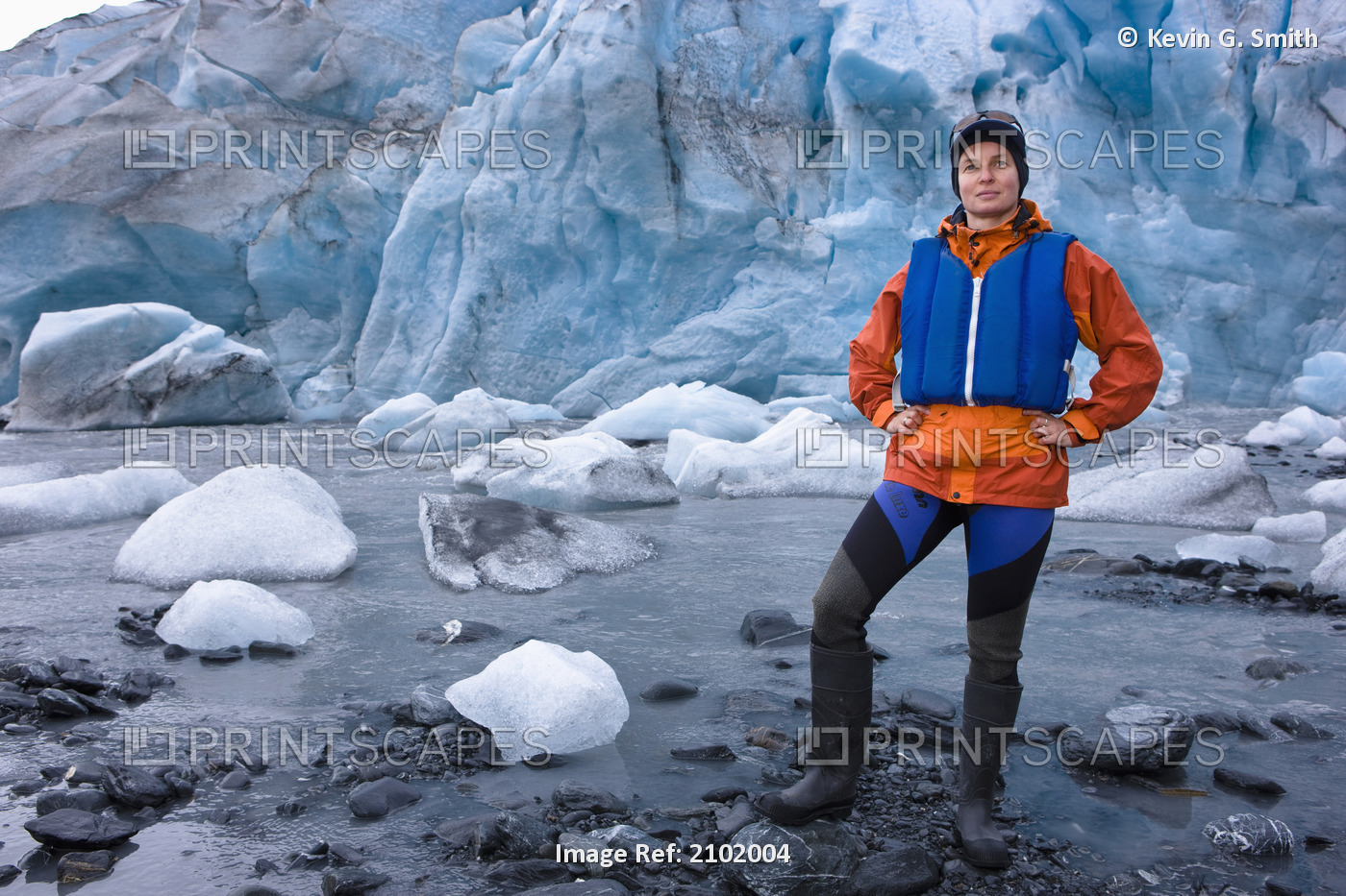 Female Kayaker Standing At The Shoreline In Front Of Shoup Glacier, Shoup Bay ...