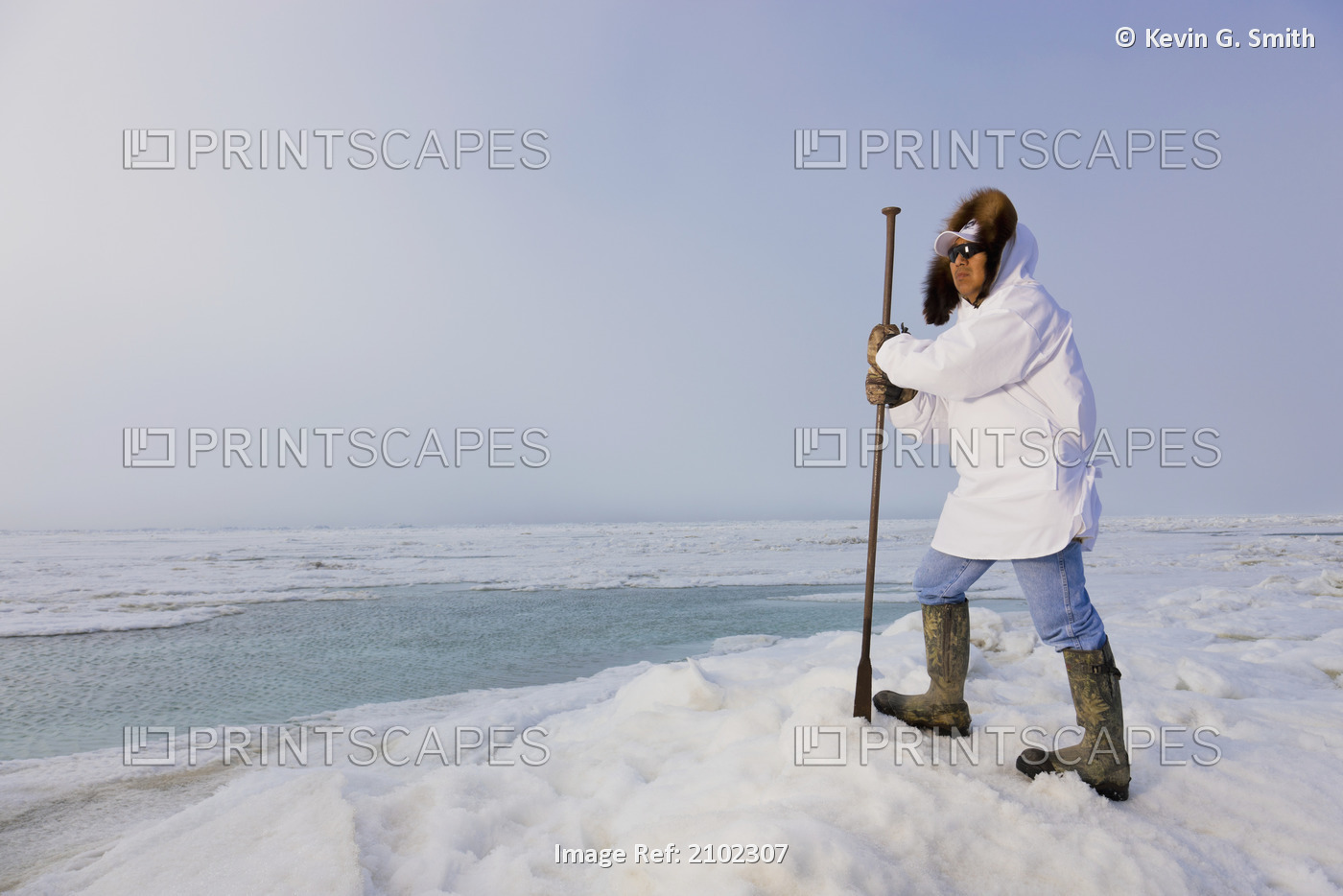 Male Inupiaq Eskimo Hunter Wearing His Eskimo Parka (Atigi) And Carrying A ...
