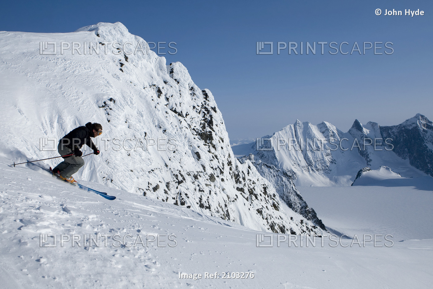 Alpine Skier Skiing On The Juneau Ice Field And Rhino Peak In The Background In ...