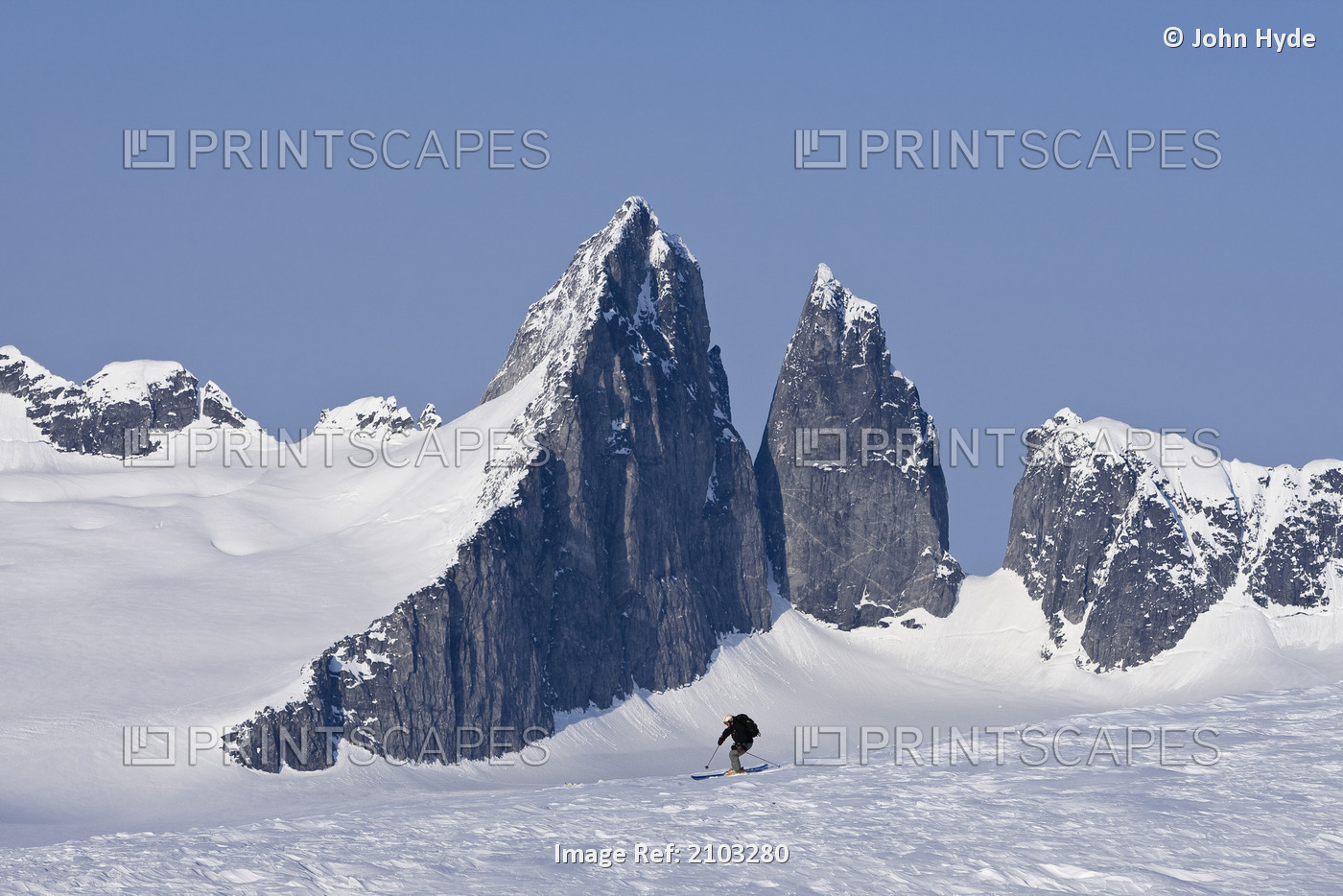 Alpine Skier Skiing On The Juneau Ice Field And Rhino Peak In The Background In ...