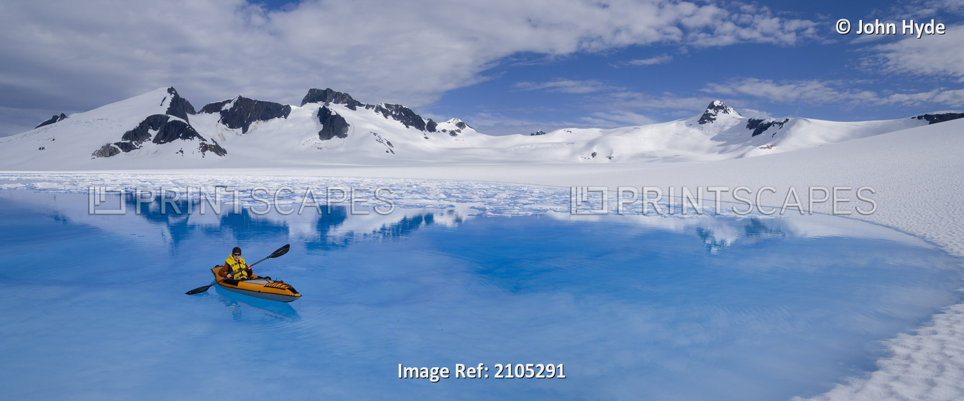 Female Kayaker Enjoying The Surreal Enviroment Of A Meltpond On The Juneau Ice ...