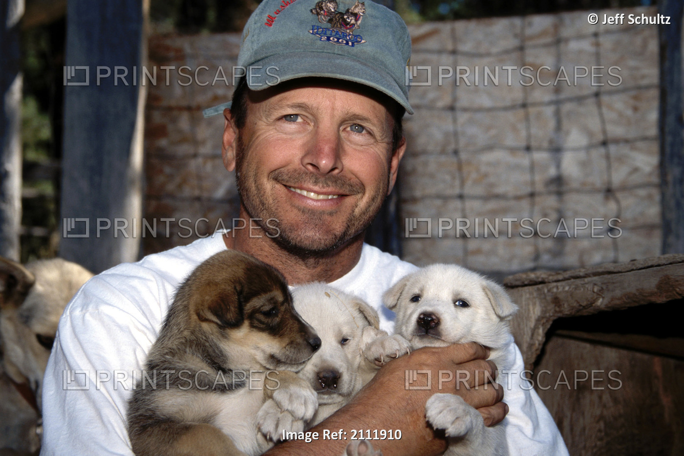 Doug Swingley Holds Husky Puppies Portrait Mt Summer