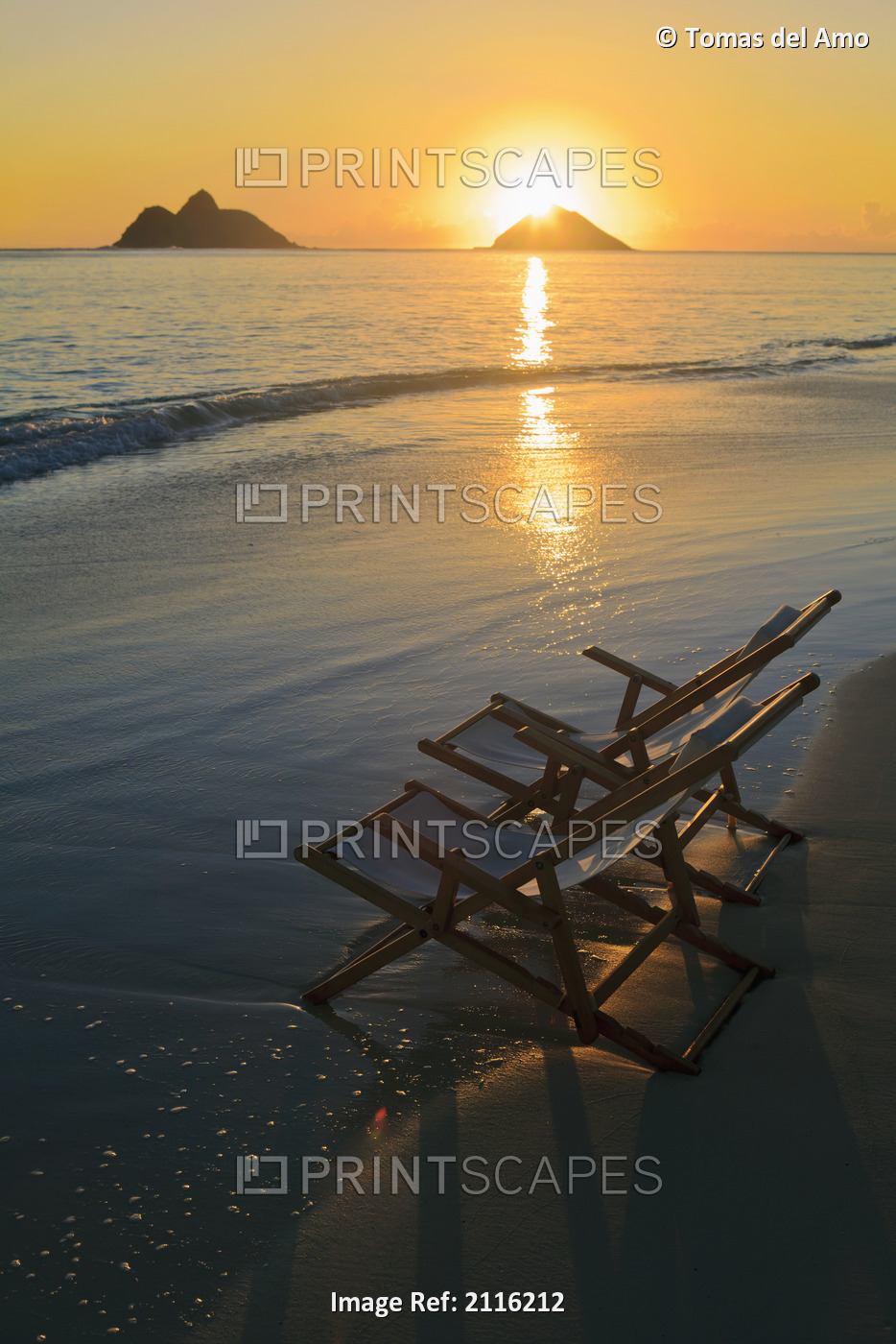 Hawaii, Lanikai, Pair of empty beach chairs at sunset.