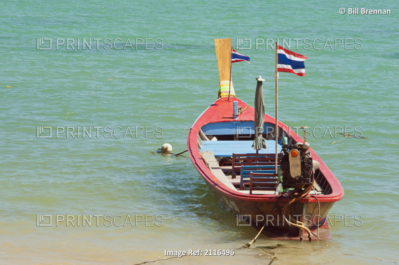Thailand, Phuket, Rawaii Beach, Close up of longtail boats along the in water.