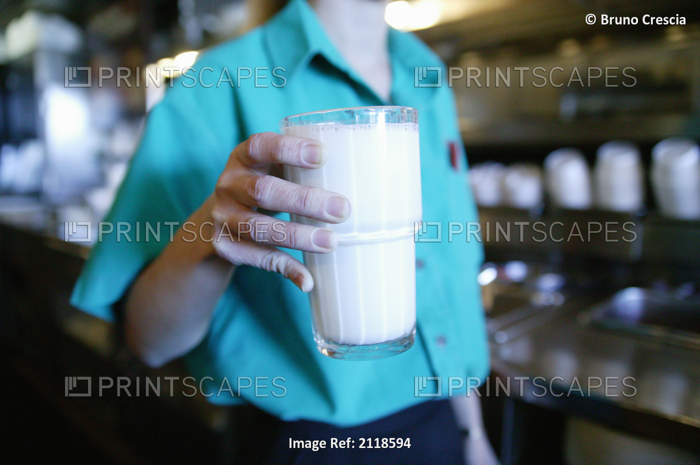 Server Holding Glass Of Milk In Diner; Oshawa Ontario Canada