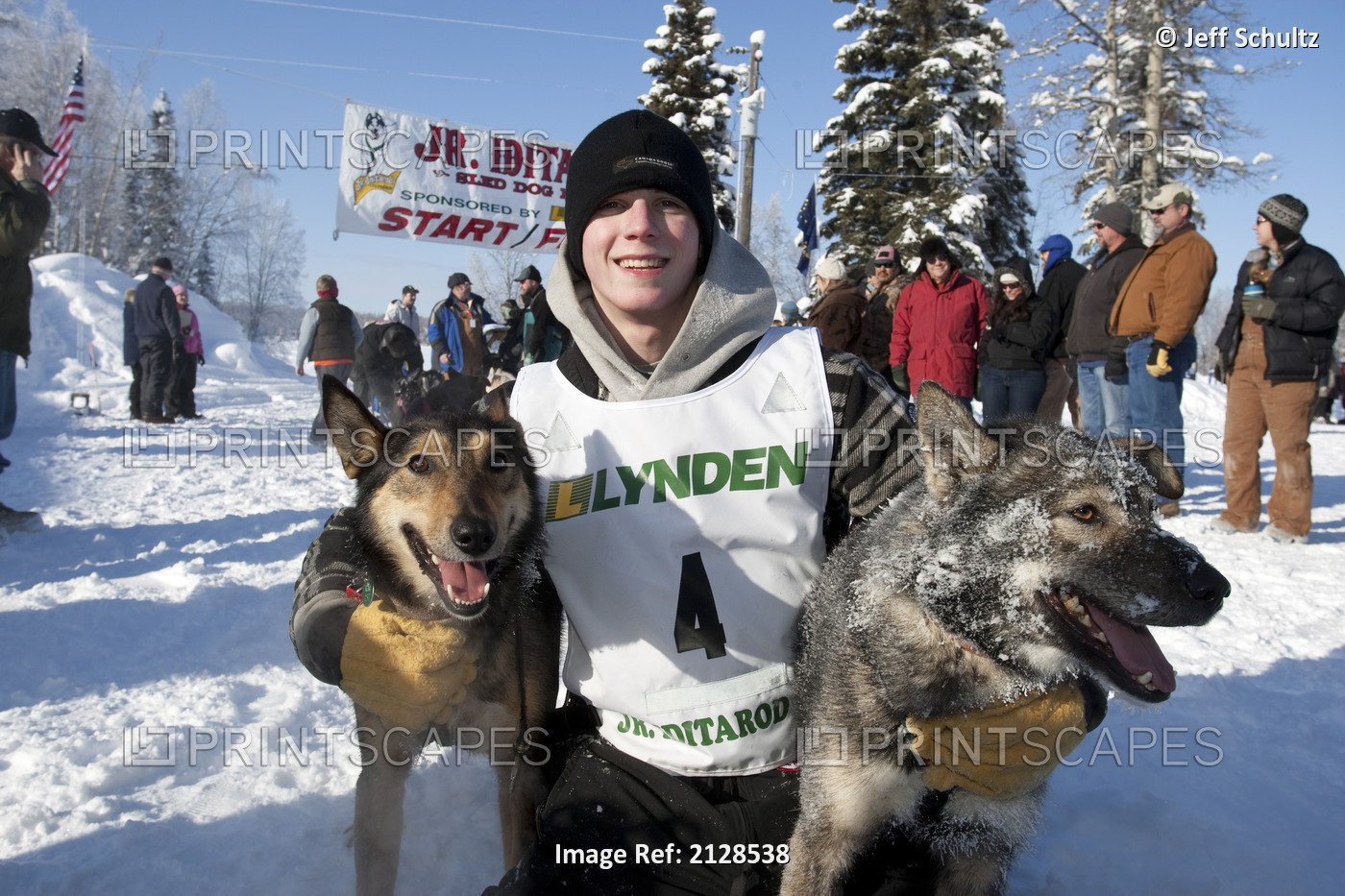 2009 Junior Iditarod Champion Cain Carter Poses With His Lead Dogs *Dred* (L) ...