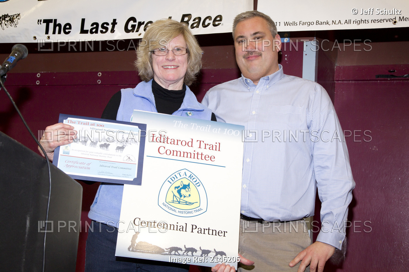 Iditarod National Historic Trail Alliance President Judy Bittner (L) Presents A ...