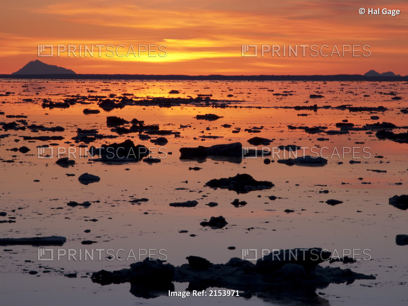 Scattered Ice On Turnagain Arm With Sun Setting Behind Mt. Redoubt, ...