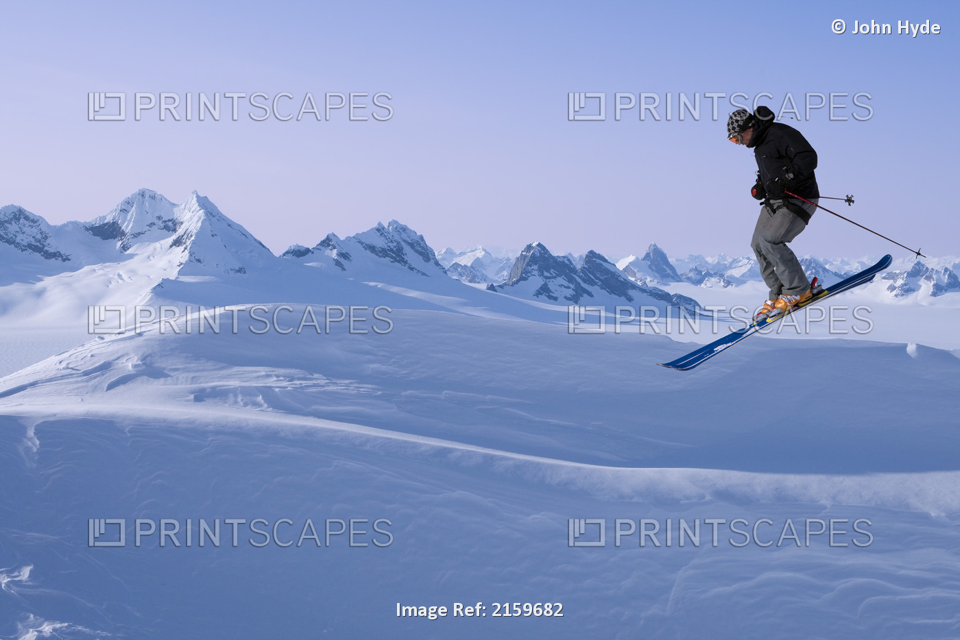 Alpine Skier Making A Jump With The Juneau Ice Field And Rhino Peak In The ...
