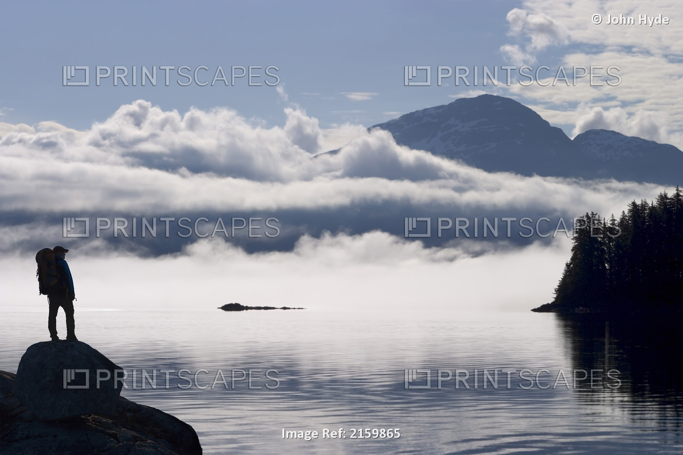 Composite: Silhouette Of A Backpacker Along The Shoreline Of Lynn Canal Near ...