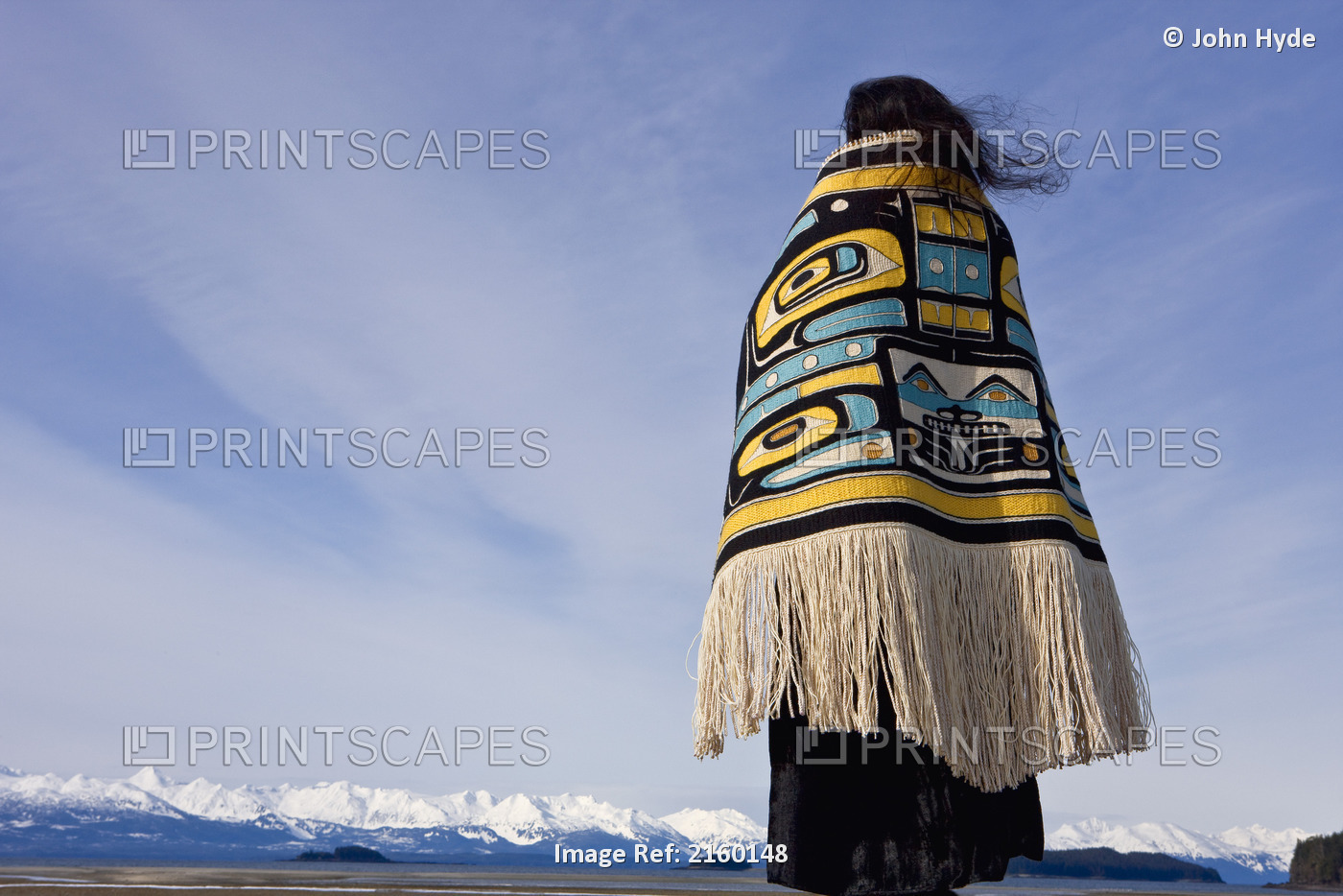 Native Alaskan Wearing A Chilkat Blanket While Looking Upward At A Soaring Bald ...