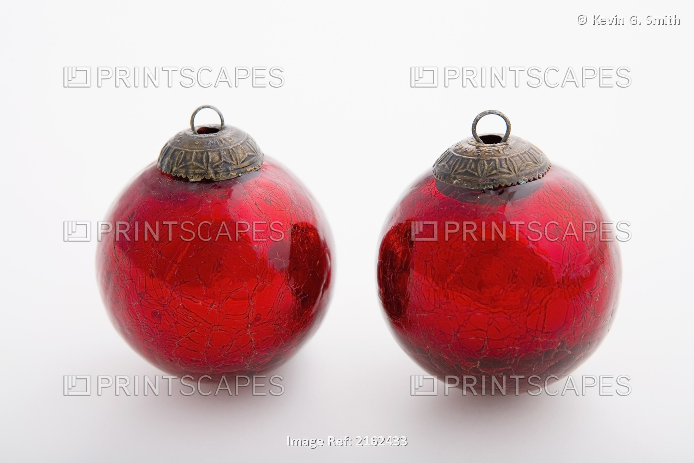 Two Red Christmas Balls With White Background Studio Portrait