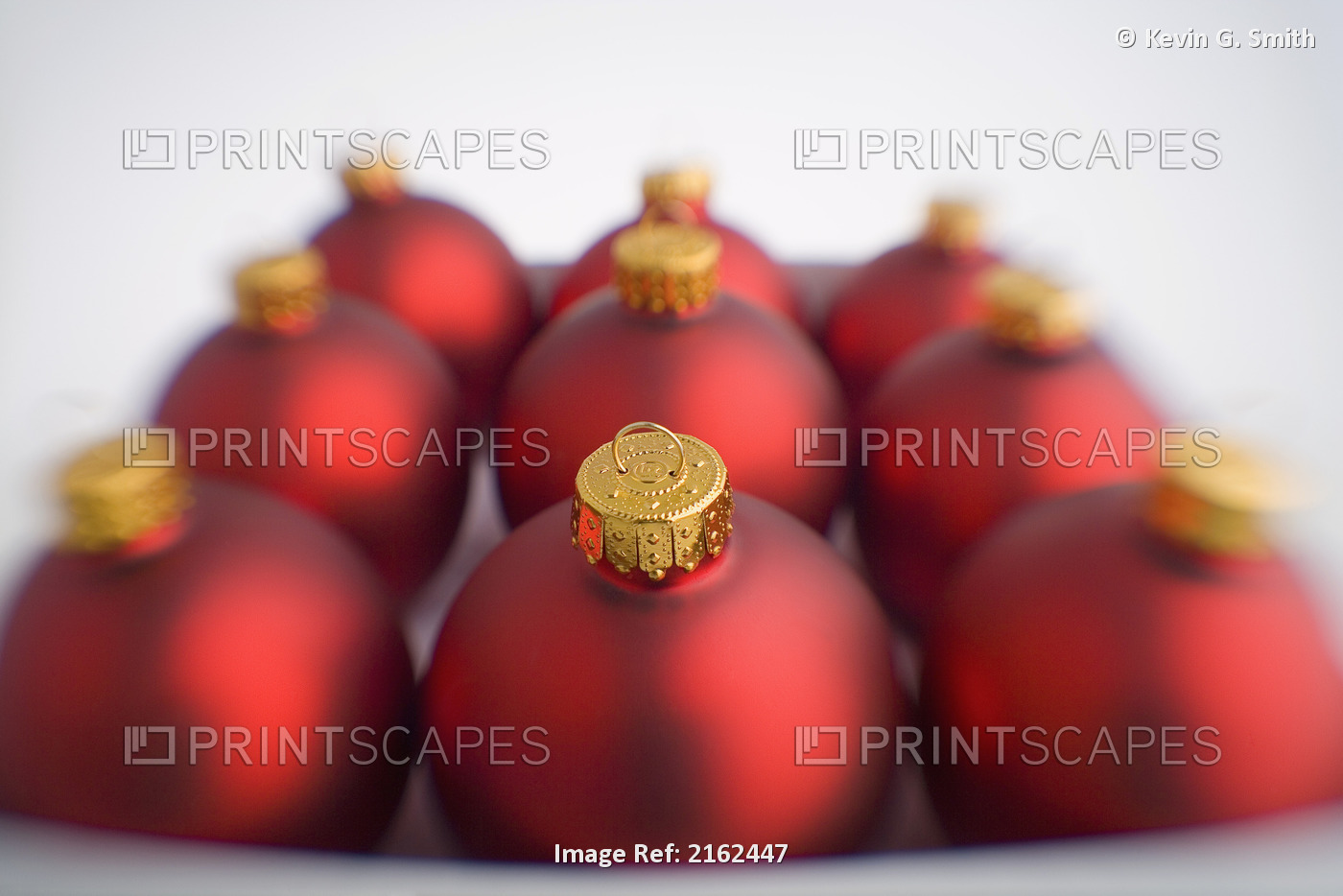 Nine Red Christmas Balls Blurred In Box On White Background With Green Filter ...