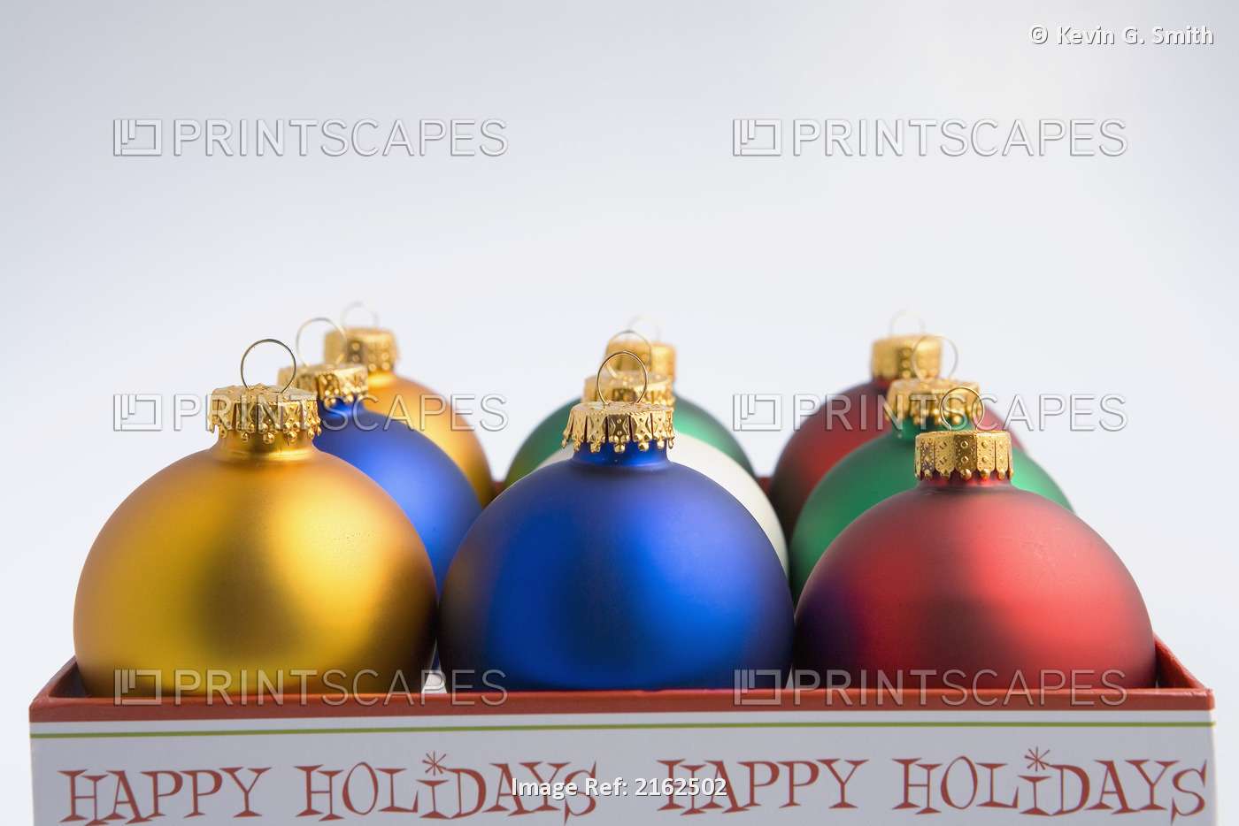Desaturated Christmas Tree Bulb Ornaments In Happy Holidays Box Studio Portrait
