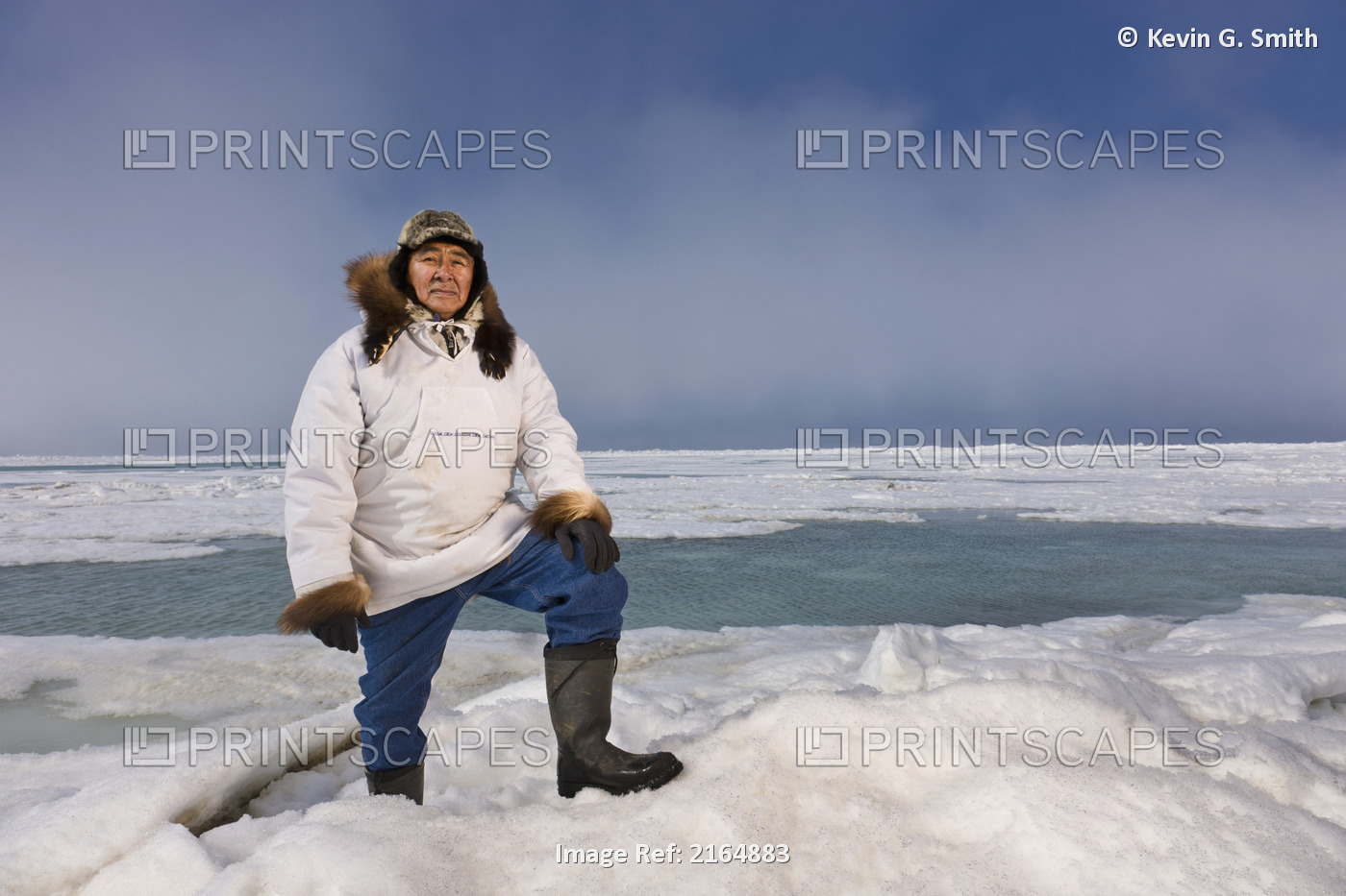 Male Inupiaq Eskimo Hunter Standing On A Ice Pressure Ridge While Wearing A ...