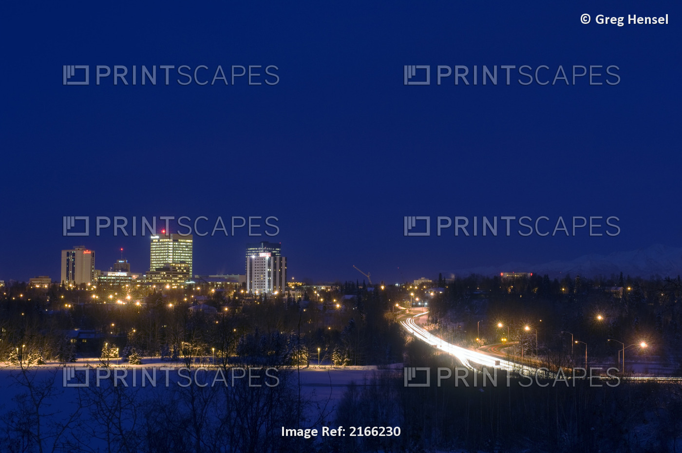 Skyline View Of Anchorage, Alaska At Night During Winter