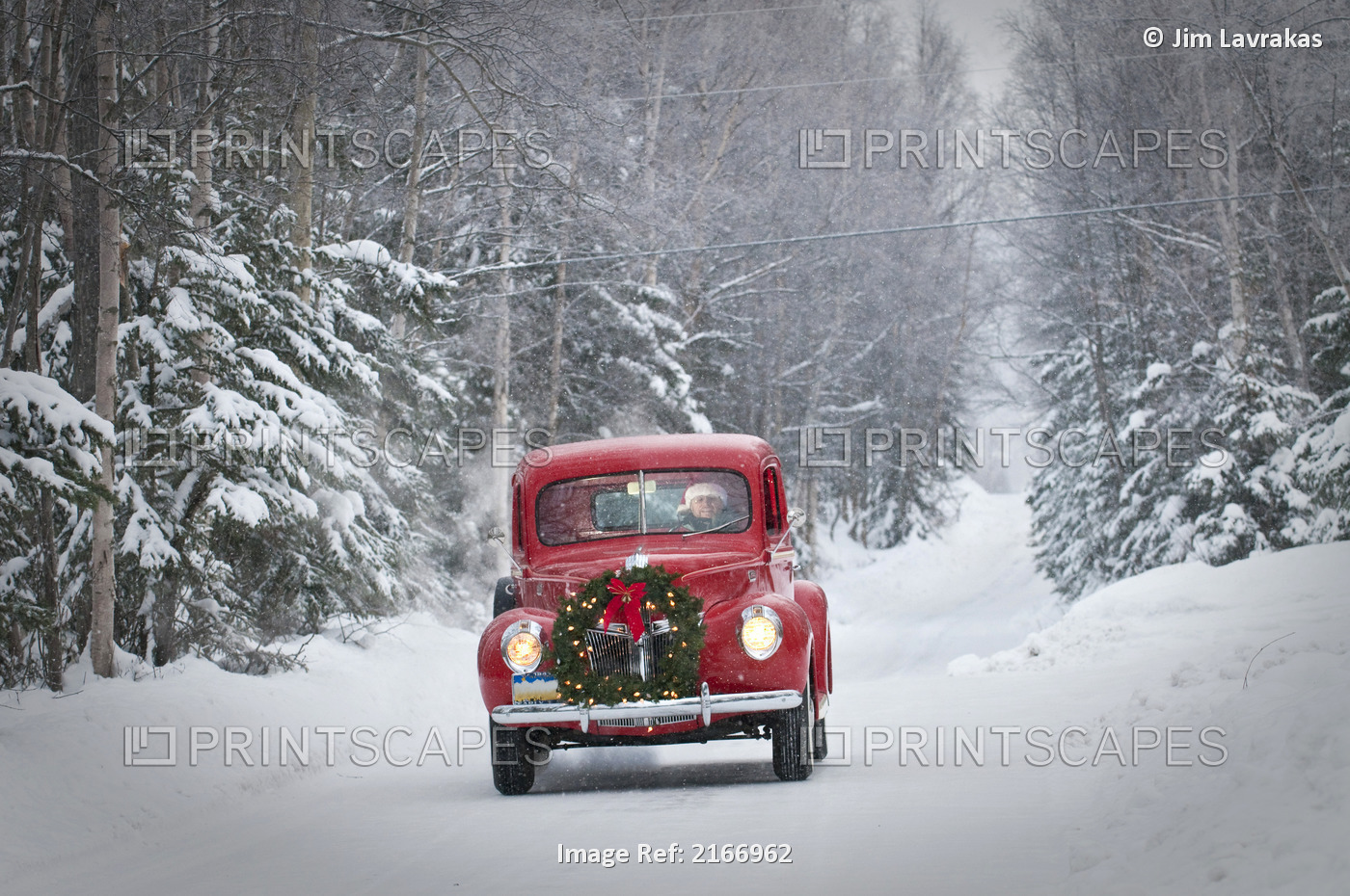 Man Driving A Vintage 1941 Ford Pickup With A Christmas Wreath On The Front ...