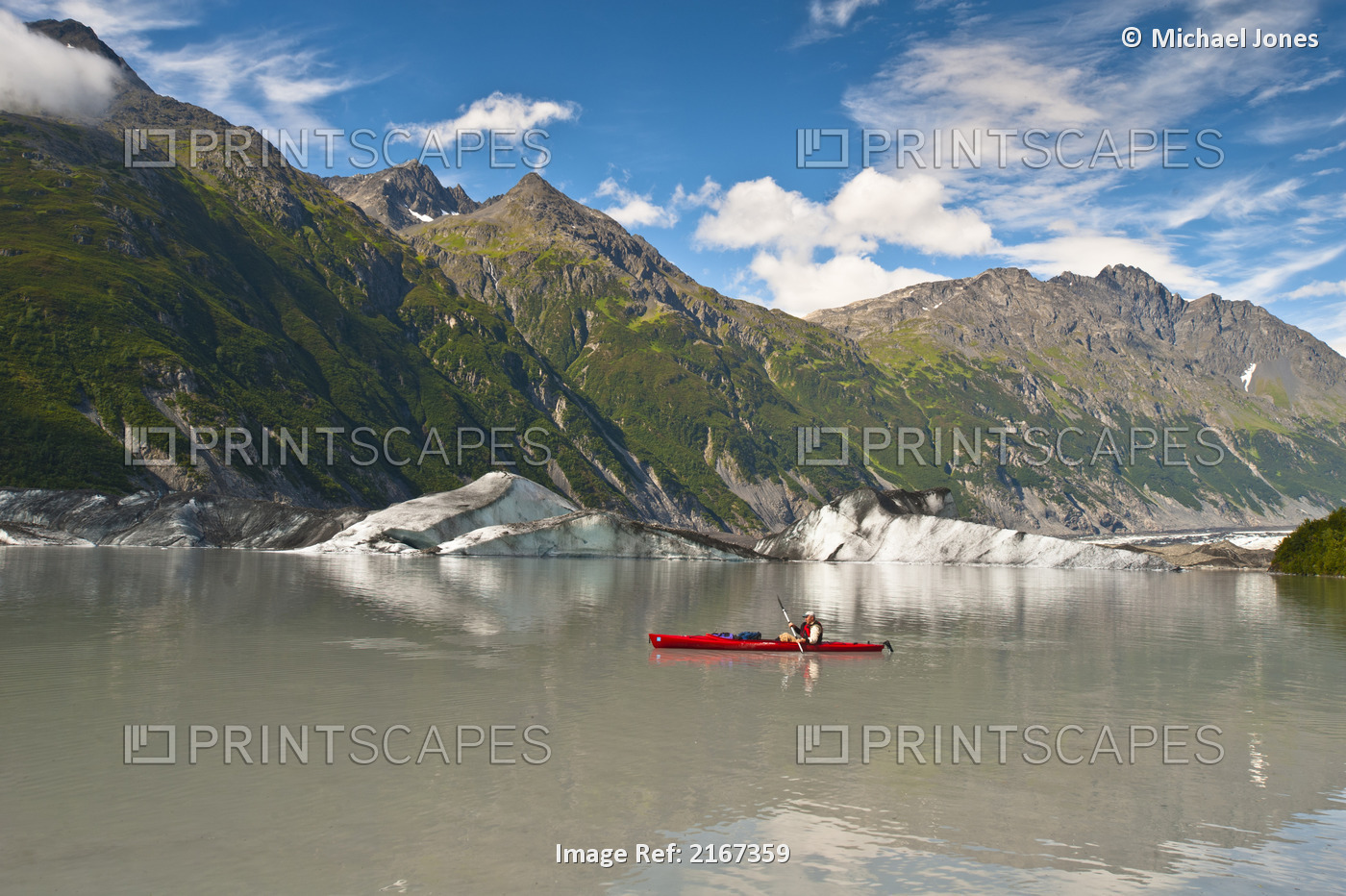 Man Kayaking Amongst Icebergs In The Lake At Valdez Glacier's Terminus, ...
