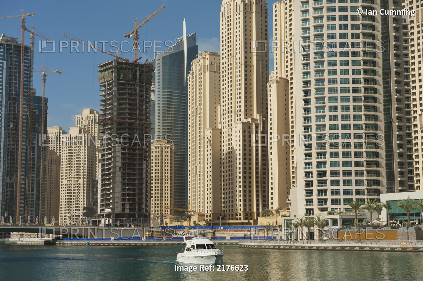 Dubai, Uaeboat In Dubai Marina In Front Of Large Residential Blocks Of Flats